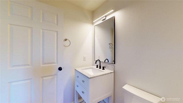 half bath with toilet and vanity