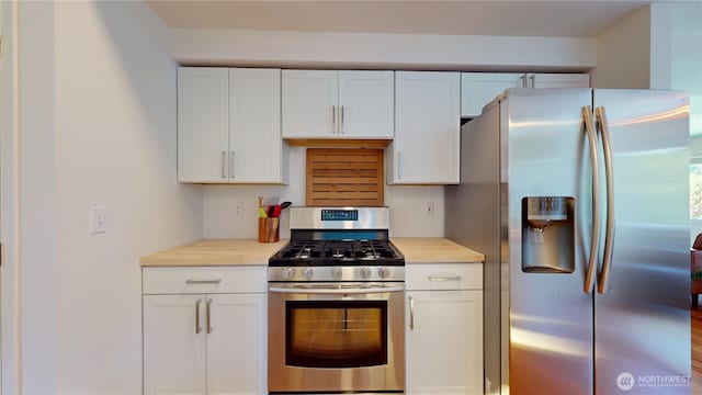 kitchen featuring light countertops, white cabinets, and appliances with stainless steel finishes