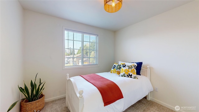 bedroom with carpet floors and baseboards