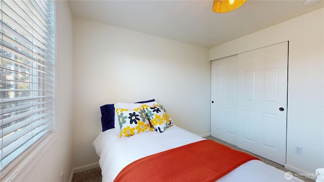 carpeted bedroom with baseboards
