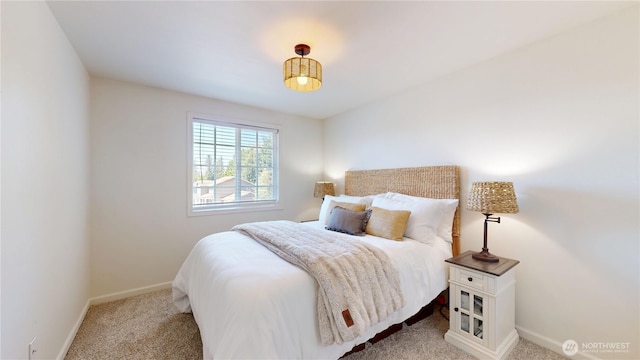 bedroom featuring carpet flooring and baseboards
