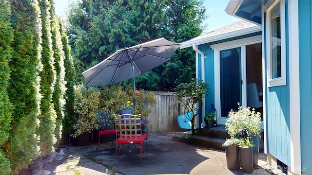 view of patio / terrace featuring fence