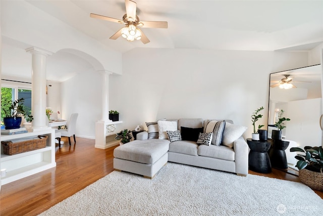 3416 189th St SE, Bothell, WA 98012 - living room featuring decorative columns, a ceiling fan, wood finished floors, vaulted ceiling, and arched walkways