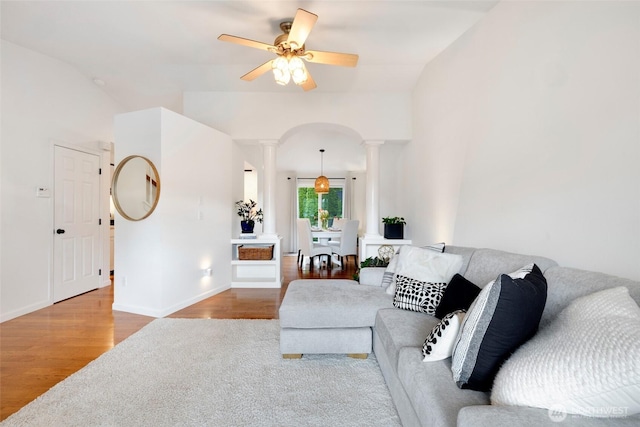 3416 189th St SE, Bothell, WA 98012 - living room with ornate columns, wood finished floors, a ceiling fan, lofted ceiling, and baseboards