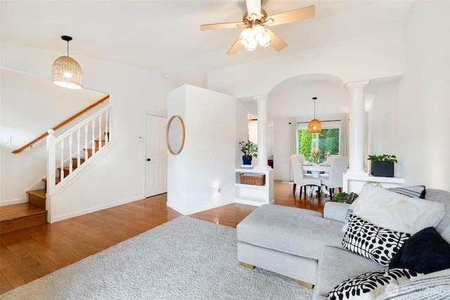 3416 189th St SE, Bothell, WA 98012 - living area with ornate columns, wood finished floors, stairway, ceiling fan, and baseboards