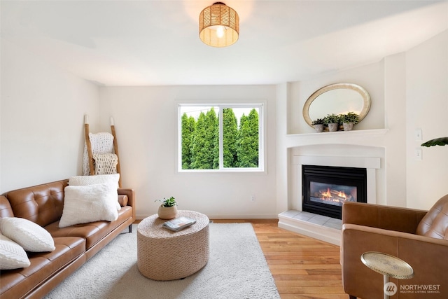 3416 189th St SE, Bothell, WA 98012 - living area with wood finished floors, a fireplace, and baseboards
