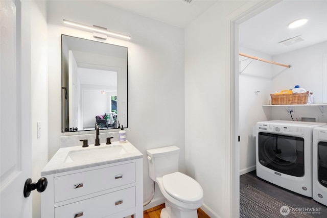 3416 189th St SE, Bothell, WA 98012 - bathroom featuring independent washer and dryer, toilet, and vanity