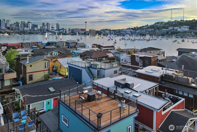 drone / aerial view of a nearby body of water and a view of skyline