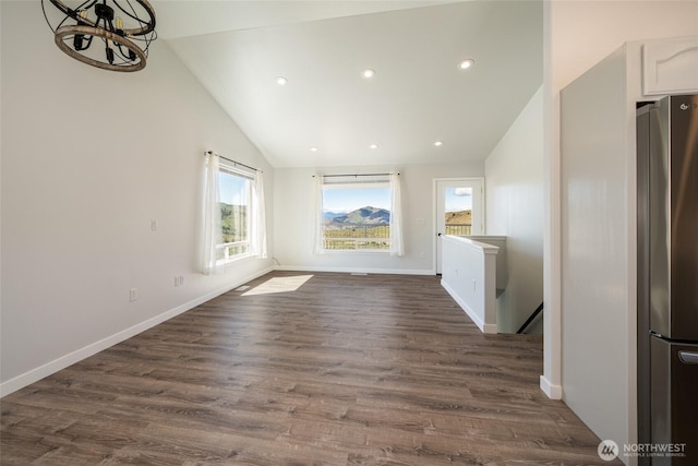 10 Spring Canyon Rd, Orondo, WA 98843 - unfurnished dining area with lofted ceiling, recessed lighting, dark wood-style floors, baseboards, and a chandelier