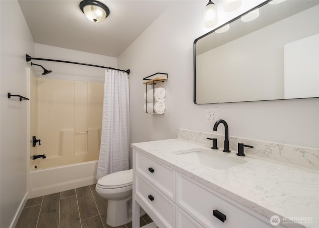10 Spring Canyon Rd, Orondo, WA 98843 - bathroom featuring vanity, toilet, shower / tub combo, wood tiled floors, and baseboards