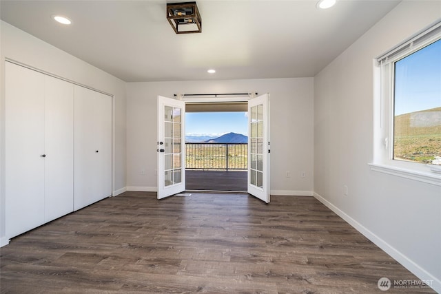 10 Spring Canyon Rd, Orondo, WA 98843 - unfurnished bedroom with french doors, multiple windows, access to exterior, baseboards, and recessed lighting