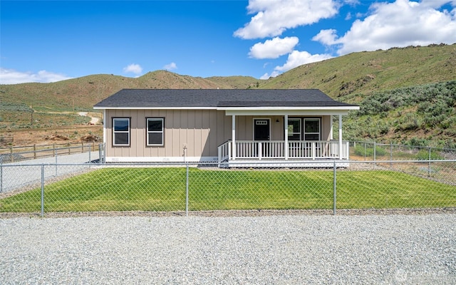 10 Spring Canyon Rd, Orondo, WA 98843 - view of front of home with covered porch, board and batten siding, and a mountain view