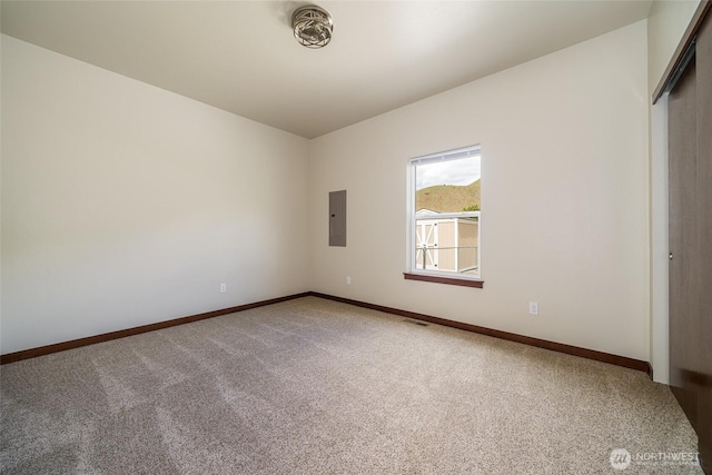 10 Spring Canyon Rd, Orondo, WA 98843 - carpeted empty room with electric panel and baseboards