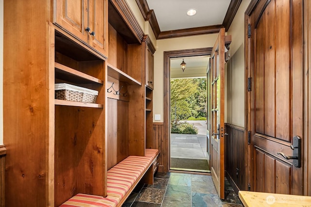 2045 250th Pl NE, Sammamish, WA 98074 - mudroom featuring stone tile floors, a wainscoted wall, and ornamental molding