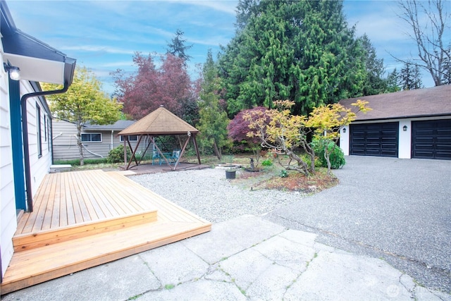 view of yard featuring a gazebo and a wooden deck