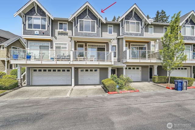 view of property with driveway and an attached garage