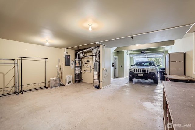 garage with electric panel, water heater, and a garage door opener