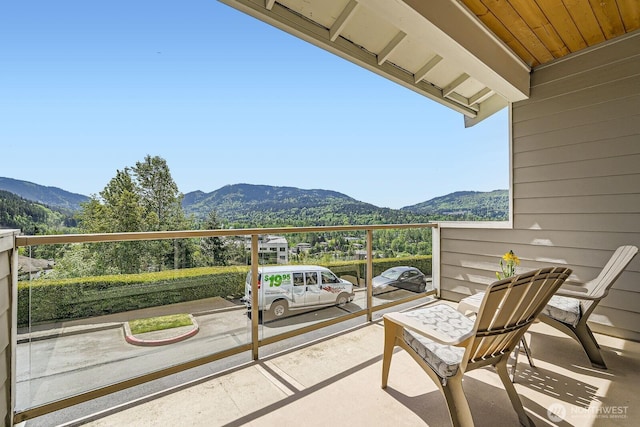 balcony featuring a mountain view