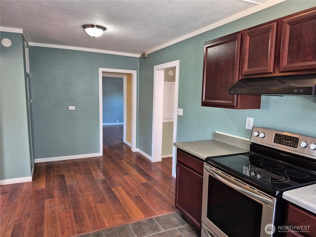 108 E 6th Ave, Ritzville, WA 99169 - kitchen with electric range, a textured ceiling, under cabinet range hood, light countertops, and ornamental molding