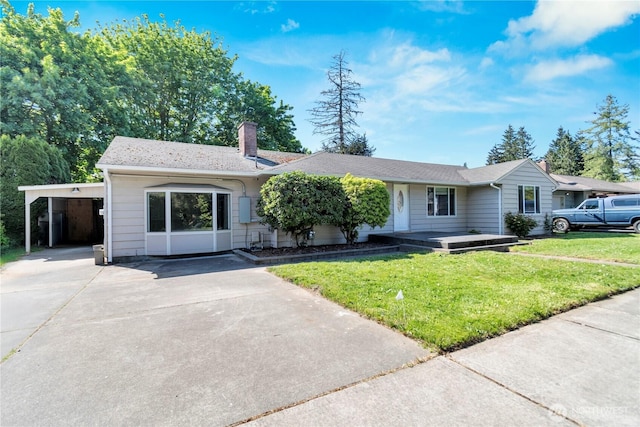 ranch-style home featuring concrete driveway, a chimney, a front lawn, and a carport