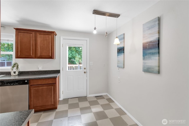doorway featuring light floors and baseboards