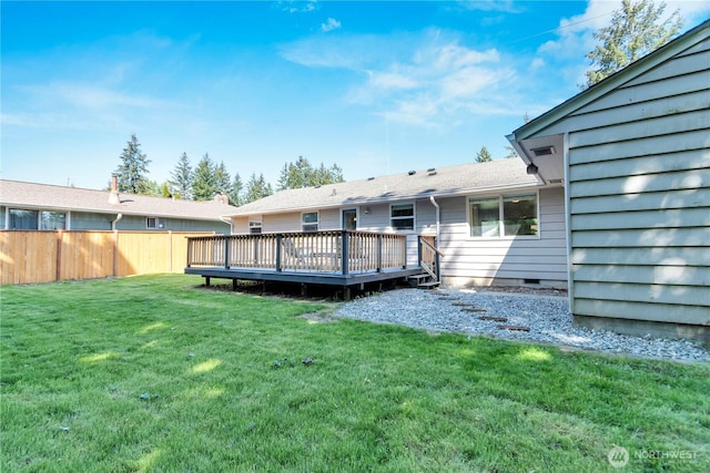 rear view of house featuring a wooden deck