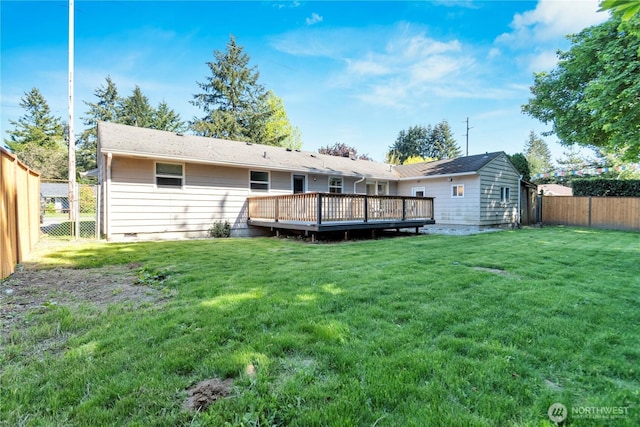 rear view of house featuring a wooden deck