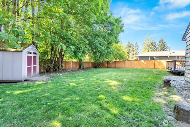 view of yard with a shed and an outbuilding