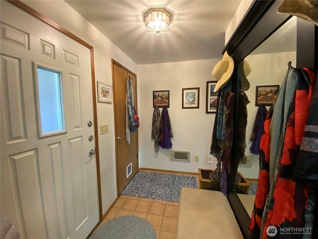 963 Hassalo Ave SE, Ocean Shores, WA 98569 - entrance foyer featuring visible vents, baseboards, and light tile patterned flooring