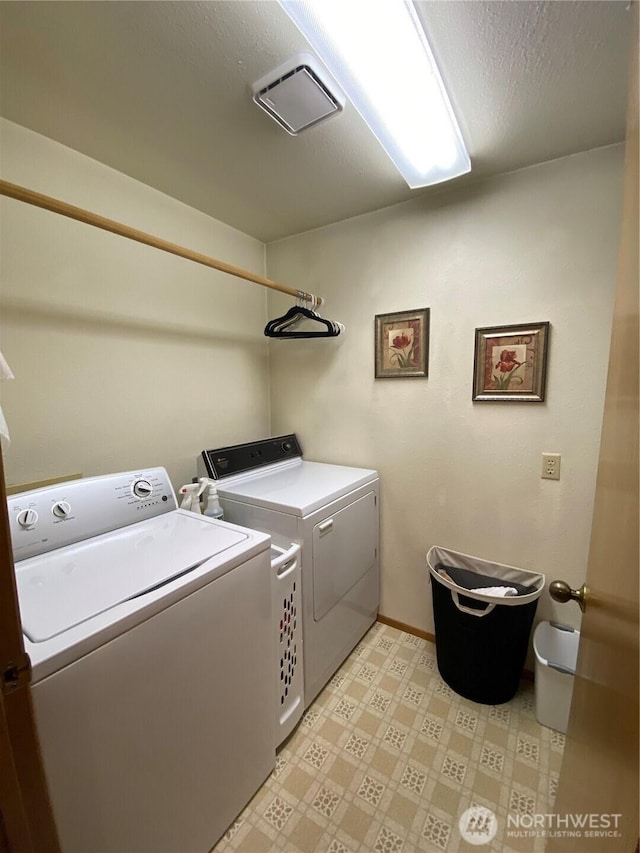 963 Hassalo Ave SE, Ocean Shores, WA 98569 - laundry room featuring baseboards, light floors, laundry area, and independent washer and dryer