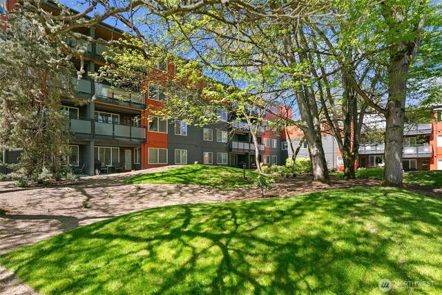 view of community featuring a lawn