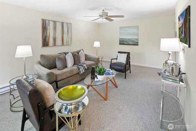 carpeted living area with a ceiling fan and baseboards