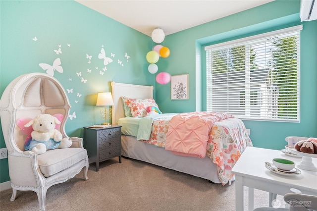 bedroom featuring carpet and an AC wall unit
