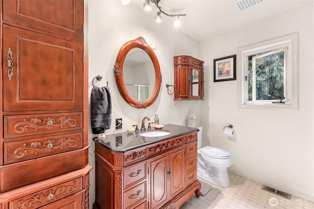 6874 Golf View Dr, Lynden, WA 98264 - bathroom with toilet, vanity, and baseboards