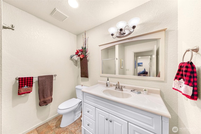 6874 Golf View Dr, Lynden, WA 98264 - bathroom with toilet, vanity, an enclosed shower, and a textured wall