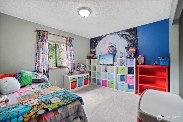 carpeted bedroom featuring a textured ceiling