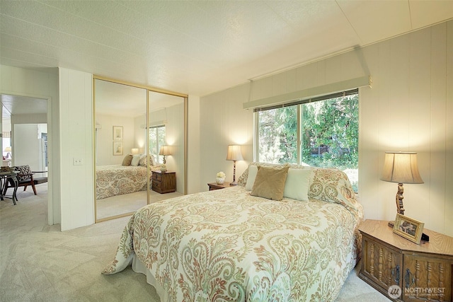 carpeted bedroom with a closet