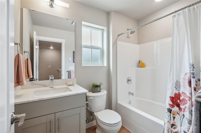 full bath with toilet, shower / tub combo with curtain, and vanity