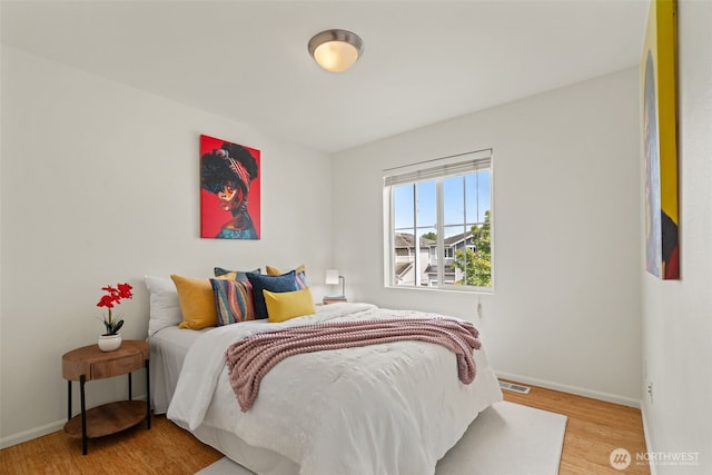 14630 35th Dr SE, Mill Creek, WA 98012 - bedroom with baseboards and light wood-type flooring