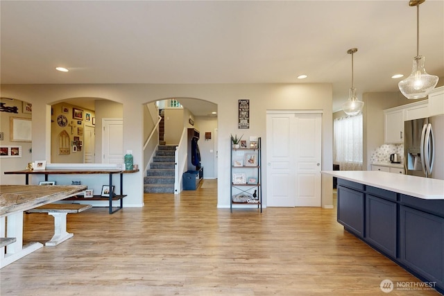 2090 Alco Ave, Walla Walla, WA 99362 - kitchen featuring light countertops, light wood-style floors, stainless steel refrigerator with ice dispenser, and recessed lighting