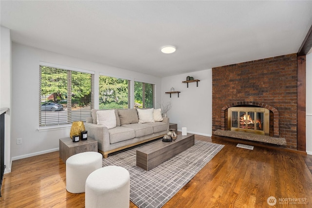 20873 2nd Pl SW, Normandy Park, WA 98166 - living room with a fireplace, wood finished floors, and baseboards