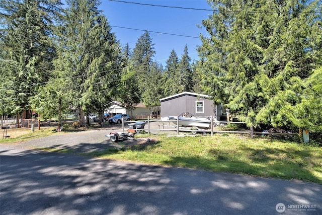 view of front of home featuring fence