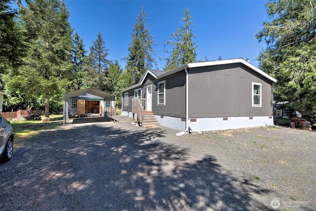 view of property exterior featuring crawl space and a carport