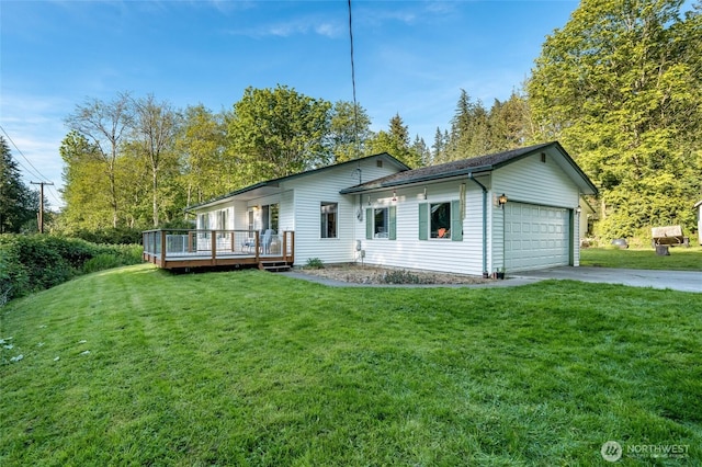 view of front of house with a deck, an attached garage, a front lawn, and concrete driveway
