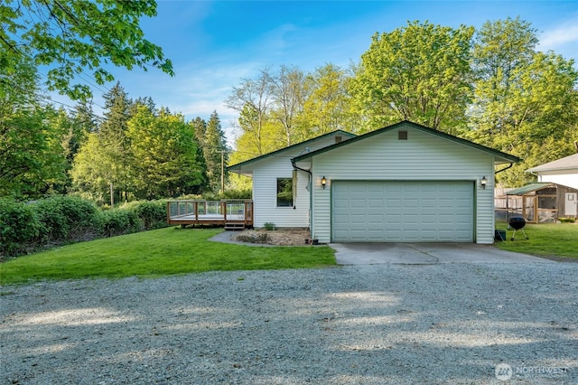 ranch-style house with driveway, a wooden deck, a front yard, and a garage