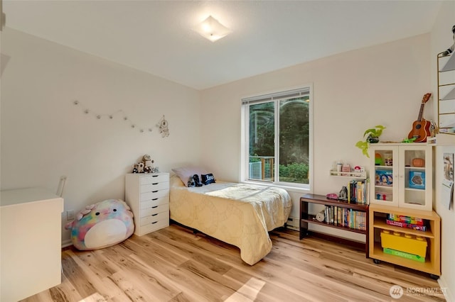 bedroom featuring light wood-type flooring