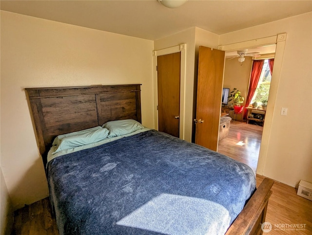 bedroom featuring wood finished floors