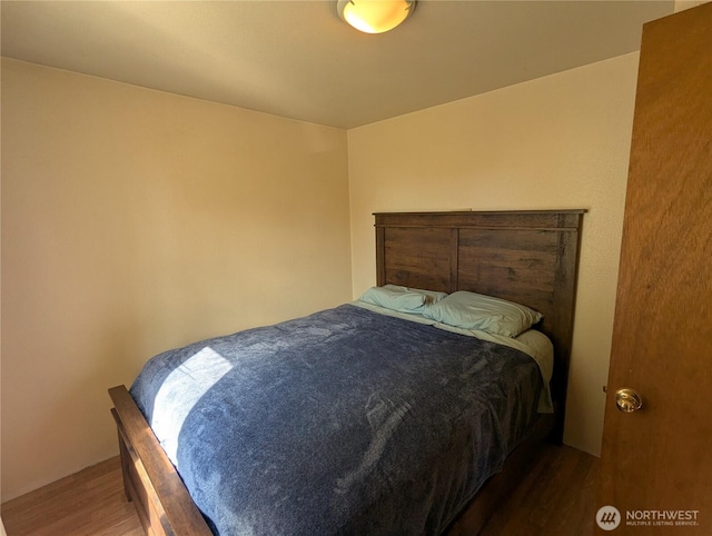 bedroom featuring wood finished floors
