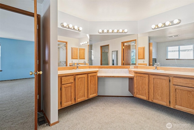 full bath with vanity and carpet