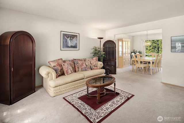 19021 113th Way SE, Renton, WA 98055 - carpeted living area with a chandelier and baseboards